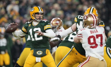 Rodgers passes during the 1st quarter of the NFC Divisional Playoff game against the San Francisco 49ers.