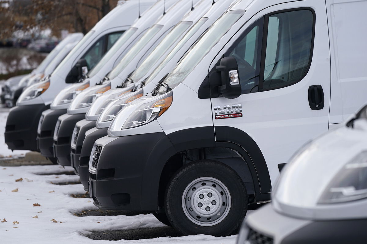 <i>David Zalubowski/AP</i><br/>A long row of unsold 2021 Promaster vans sits at a Ram dealership Sunday