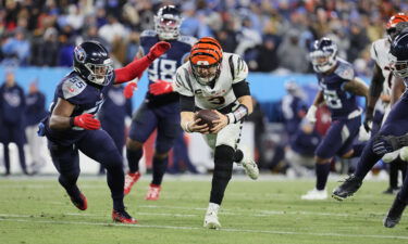 Joe Burrow rushes against the Tennessee Titans during their AFC Divisional Playoff Game.