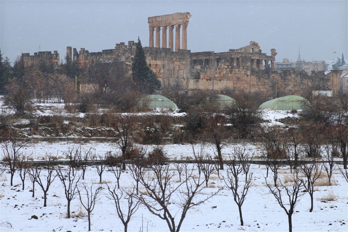 <i>-/AFP/AFP via Getty Images</i><br/>Snow covers the Roman Temple of Jupiter in Lebanon's eastern Bekaa Valley