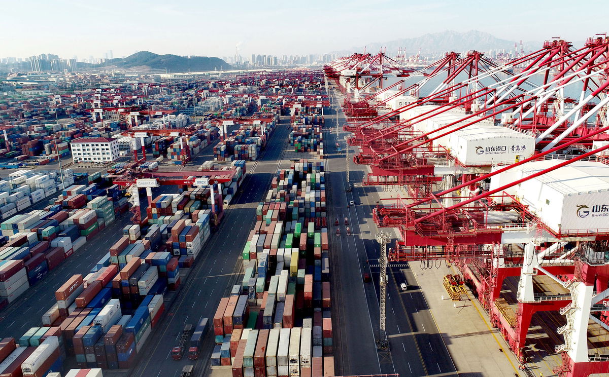 <i>Zhang Jingang/VCG/Getty Images</i><br/>Aerial view of shipping containers sitting stacked at Asia's first fully automated container terminal of Qingdao Port on January 14