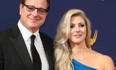 Bob Saget's wife Kelly Rizzo shares an emotional tribute to him. The couple here attends the 2018 Creative Arts Emmy Awards on September 8