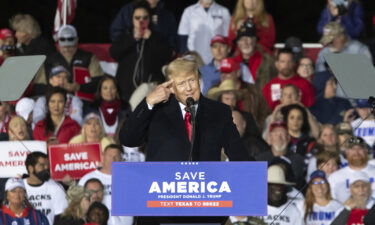 Former US President Donald Trump gestures as he speaks during a "Save America" rally in Conroe