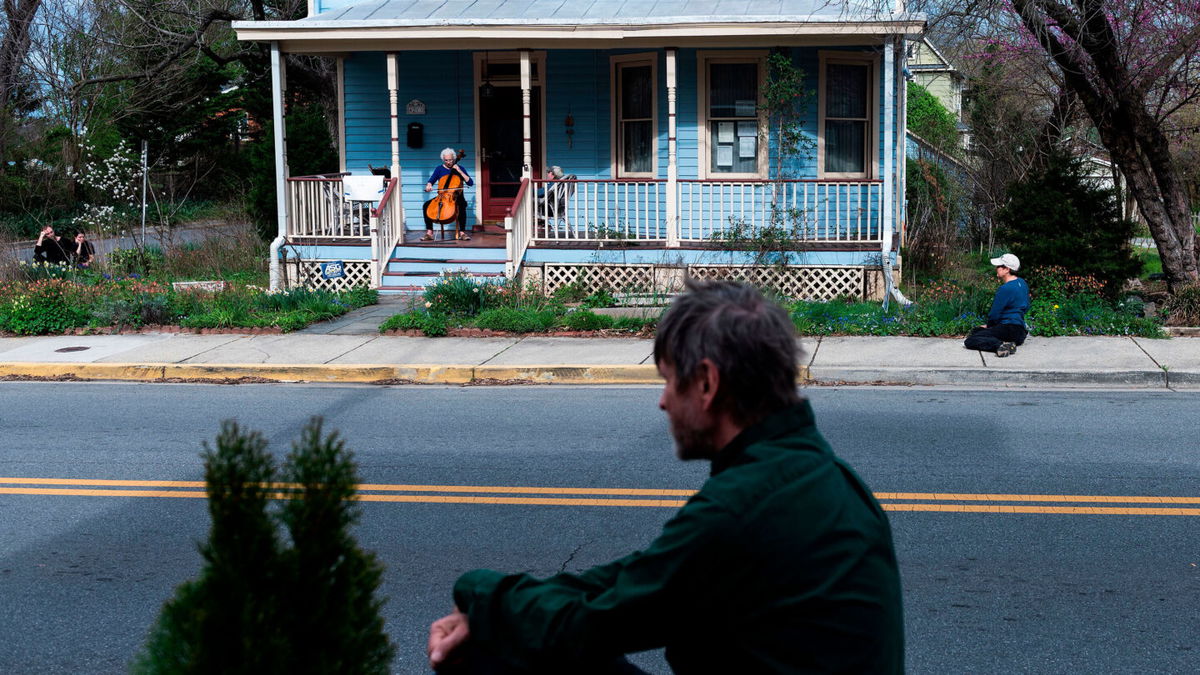 <i>Andrew Caballero-Reynolds/AFP/Getty Images</i><br/>Cellist Jodi Beder performs a daily concert on her front porch in Mount Rainier