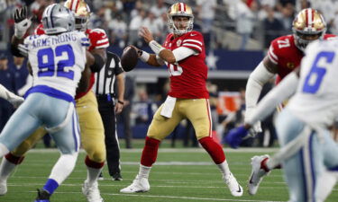 49ers QB Jimmy Garoppolo looking to pass against the Dallas Cowboys.