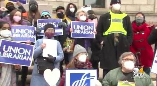 <i>WBZ</i><br/>Library workers hold a ‘Fill the Library with Love’ rally after disruptive protests.