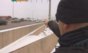 Trooper Travis Hood points to the spot of a near-fatal accident on Feb. 17.