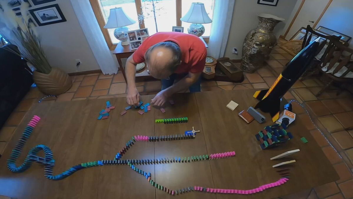 <i>KPHO/KTVK</i><br/>Gloria Woodman and Robert Dehate have turned their love of dominos into a never-ending challenge to build something bigger and better every time they gather around the dining room table or pour a pack of dominos on the floor.