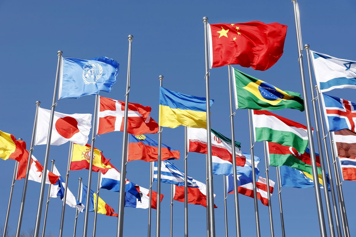 <i>Kyodo News/Getty Images</i><br/>National flags fly at the Beijing Winter Paralympic athletes' village in the Chinese capital on Feb. 26