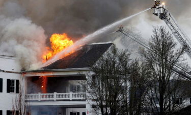 Firefighters from multiple departments at work on the fire.