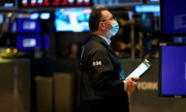 Traders work on the floor of the New York Stock Exchange at the opening bell on February 22 in New York.