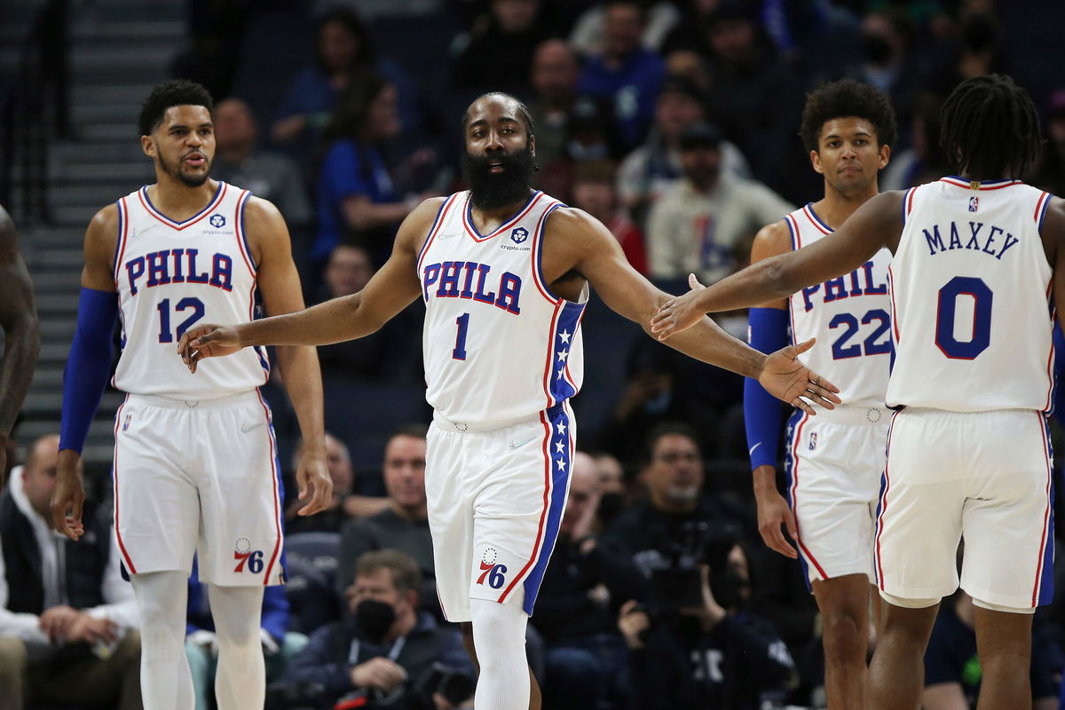 <i>Stacy Bengs/AP</i><br/>Harden slaps hands with guard Tyrese Maxey during the first half of the team's game against the Timberwolves.