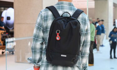 A keyring containing an AirTag attached to a rucksack inside the Apple Store in 2021 in Sydney