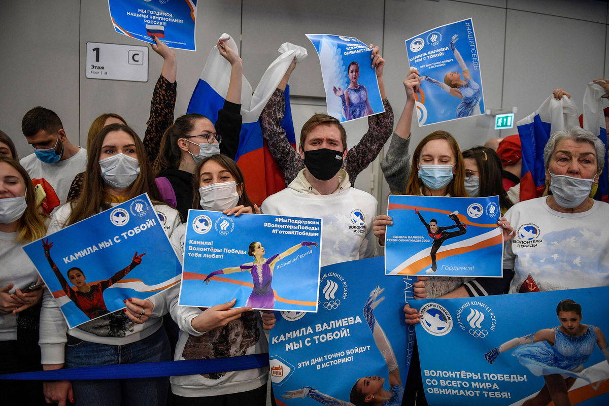 <i>Alexander Nemenov/AFP/Getty Images</i><br/>Supporters of Valieva await the figure skater's arrival at the Sheremetevo airport outside Moscow.