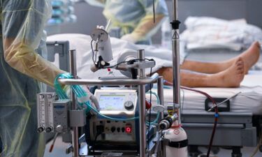 A patient affected by Covid-19 lies with an artificial respiration ECMO in the Covid-19 intensive care unit at a hospital in Bochum