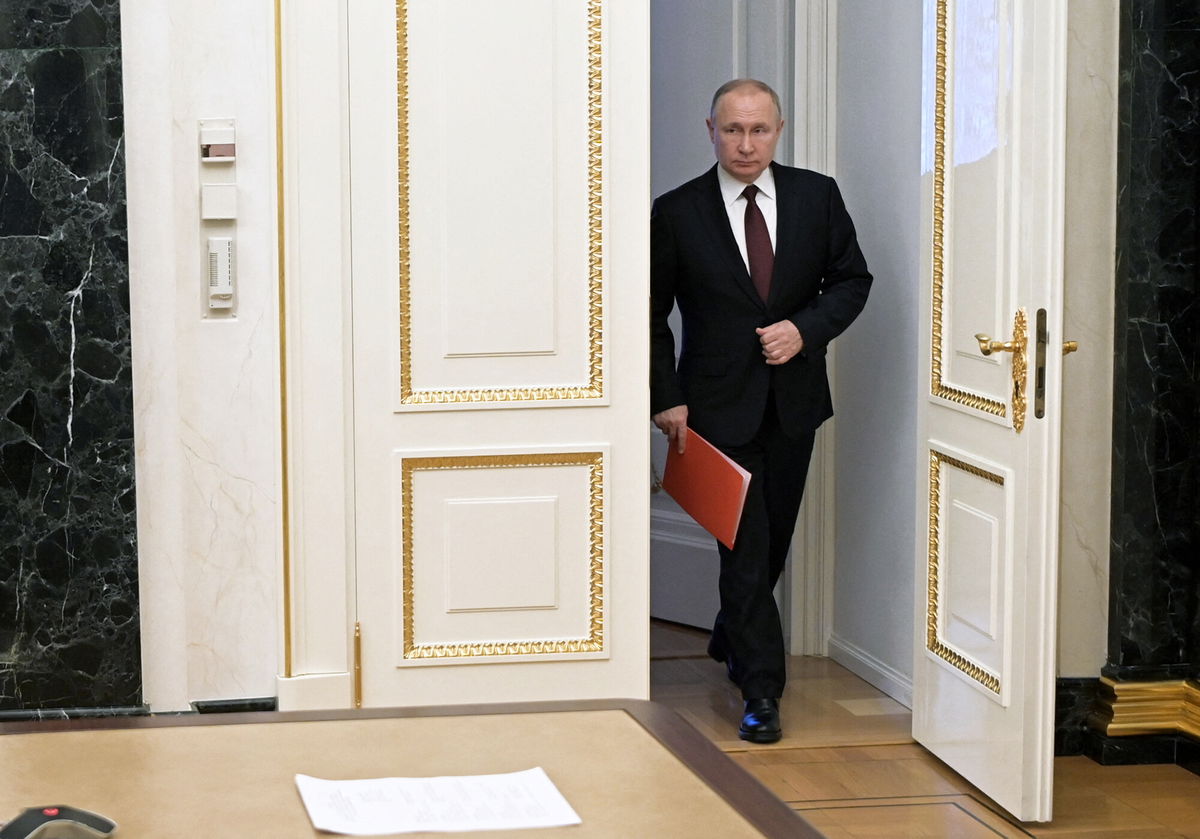 <i>Alexey Nikolsky/Sputnik/AFP/Getty Images</i><br/>Russian President Vladimir Putin arrives to chair a Security Council meeting via a video link in Moscow on February 25.