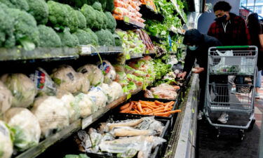 Shoppers wear protective masks at a grocery store in Washington