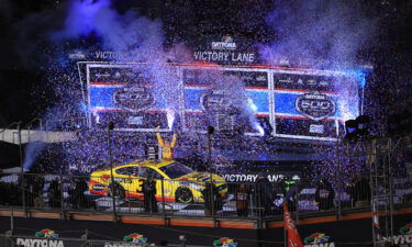 Michael McDowell celebrates in victory lane after winning the 2021 Daytona 500.