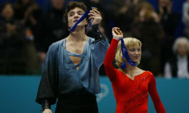 Elena Berezhnaya and Anton Sikharulidze of Russia celebrate gold at the Salt Lake City Winter Olympics.