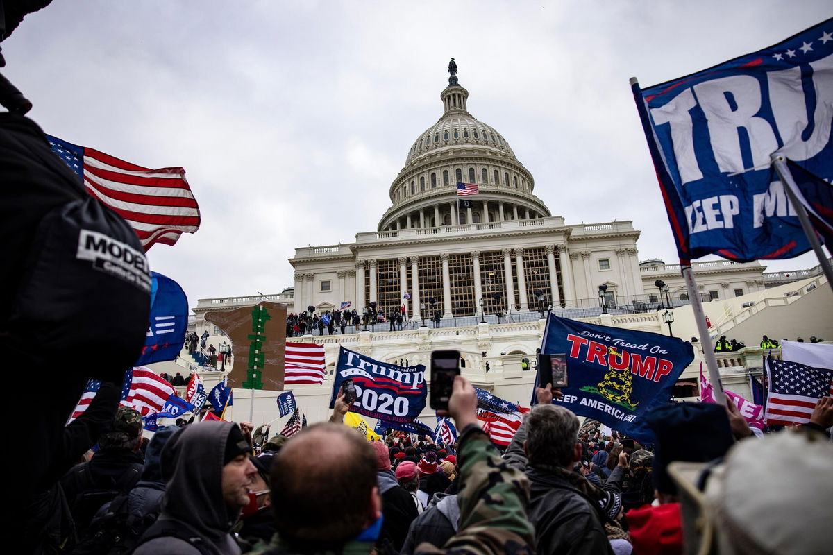 <i>Samuel Corum/Getty Images</i><br/>Pro-Trump supporters storm the US Capitol following a rally with President Donald Trump on January 6