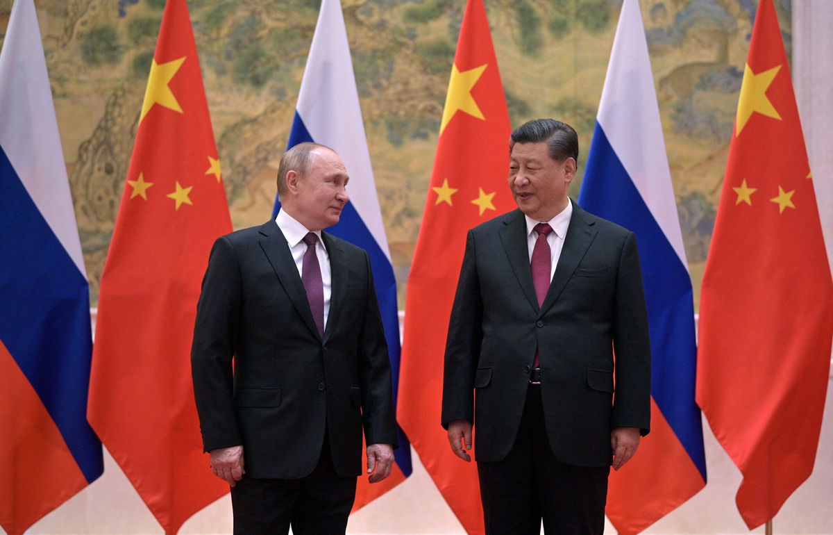 <i>ALEXEI DRUZHININ/AFP/Sputnik/Getty Images</i><br/>Russian President Vladimir Putin and Chinese leader Xi Jinping meet in Beijing on February 4. As Russian missiles flew through the Ukrainian sky and world leaders decried an invasion spreading across the country