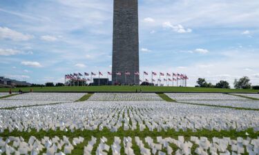 The Washington monument sits as a backdrop to the 'In America: Remember' public art installation near on the National Mall in 2021 in Washington
