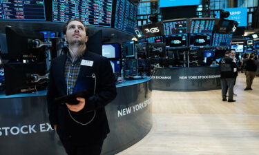 Solid earnings season wasn't enough to calm investors. Traders here work on the floor of the New York Stock Exchange on February 18