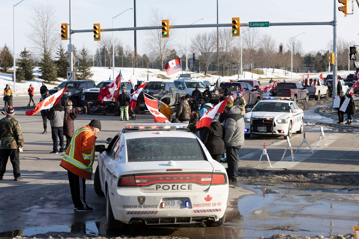 <i>Nicole Osborne/AP</i><br/>People take part in a protest blocking traffic at the Ambassador Bridge