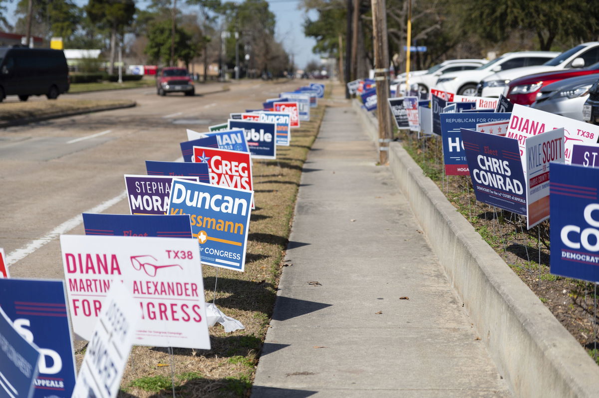 <i>Jennifer Lake/SIPA/AP Images</i><br/>Campaign signs line the sidewalks on February 18