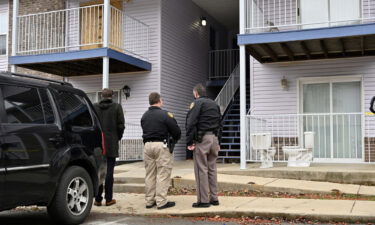 Authorities stand guard as jurors are given a walk-through of Breonna Taylor's apartment in Louisville on February 25.