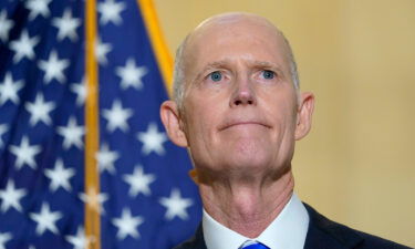 Florida GOP Sen. Rick Scott talks with reporters on Capitol Hill on January 20.