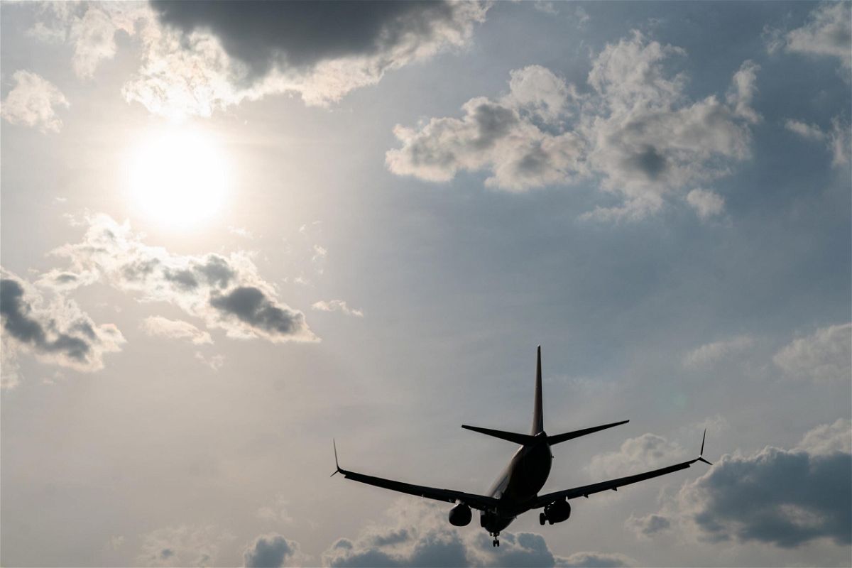 <i>Elijah Nouvelage/Bloomberg/Getty Images</i><br/>A plane approaches Hartsfield-Jackson Atlanta International Airport in Atlanta