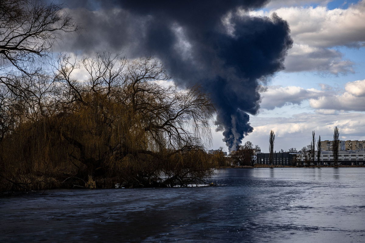 <i>Dimitar Dilkoff/AFP/Getty Images</i><br/>Smoke billows over the town of Vasylkiv just outside Kyiv on February 27