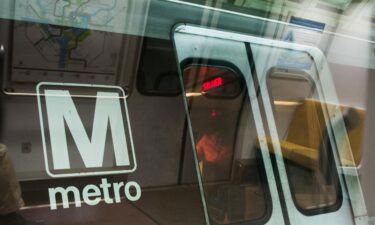 A Metro train stops at a station in Washington