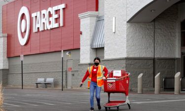 A worker brings merchandise to a customer who opted for pick-up service at a Target store in Chicago.