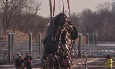 Recovery crews have removed a car from Darby Creek in Ridley Township after divers recently discovered human remains inside the car.
