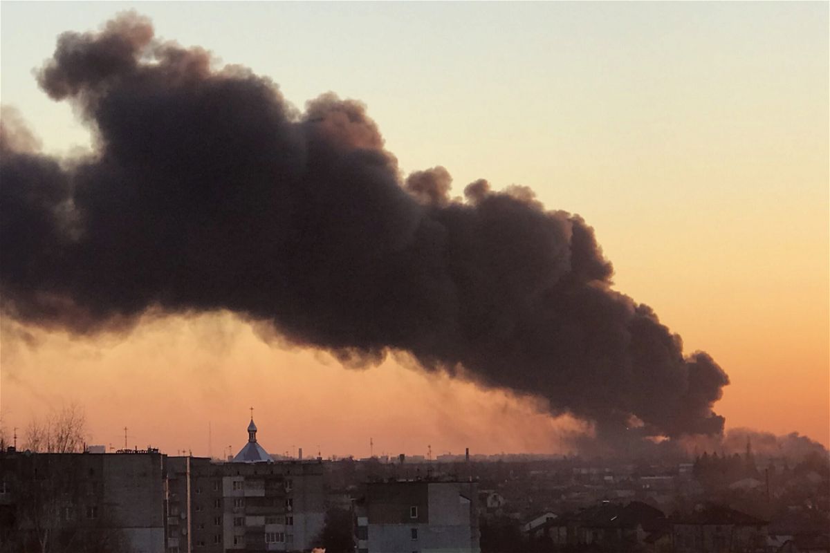 <i>AP</i><br/>A cloud of smoke raises after an explosion in Lviv