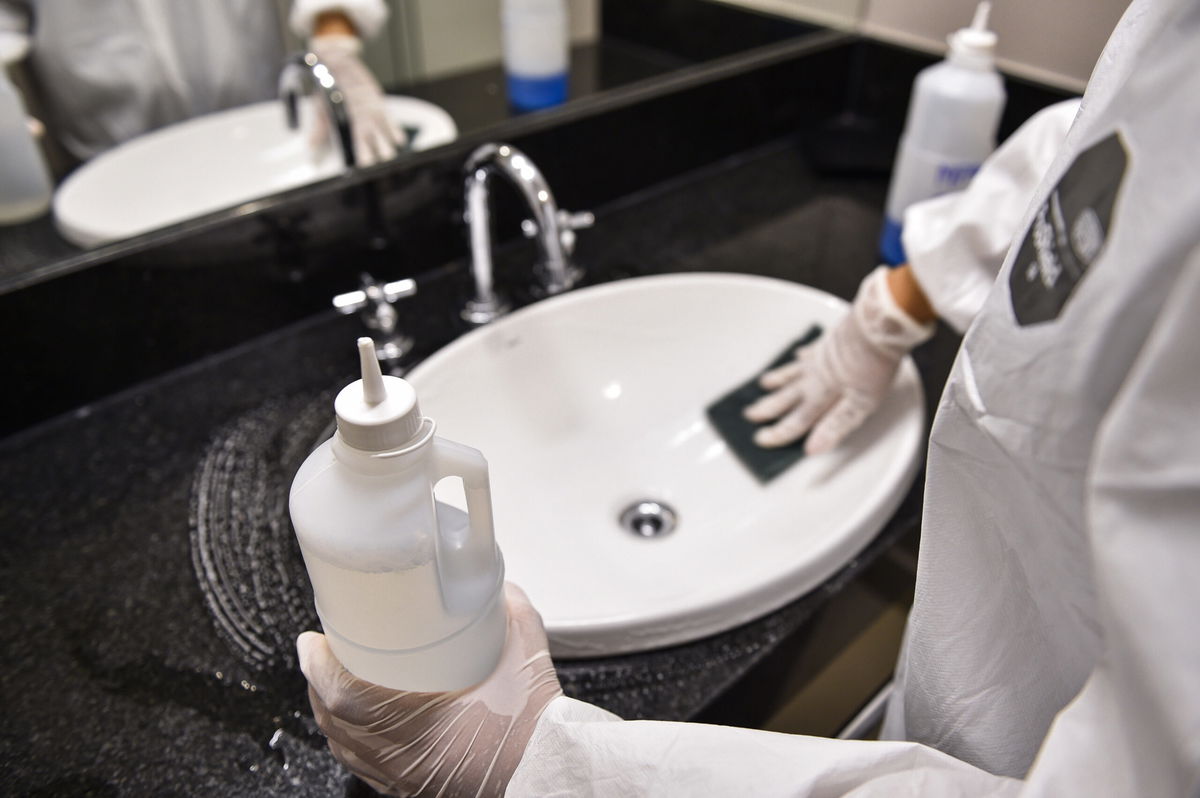 <i>Pedro Vilela/Getty Images South America/Getty Images</i><br/>A member of the cleaning team disinfects a room at the Vivenzo hotel on April 7