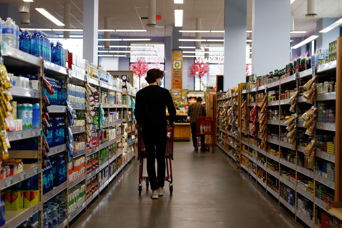 <i>Ting Shen/Xinhua/Getty Images</i><br/>Consumers shop at a grocery store in Washington