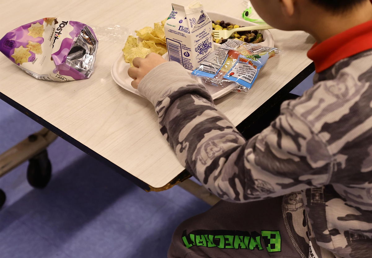 <i>Michael Loccisano/Getty Images</i><br/>A student eats a meal served for lunch at a school in New York City on February 4.