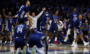 Saint Peter's celebrates after winning a college basketball game against Purdue in the Sweet 16 round of the NCAA tournament
