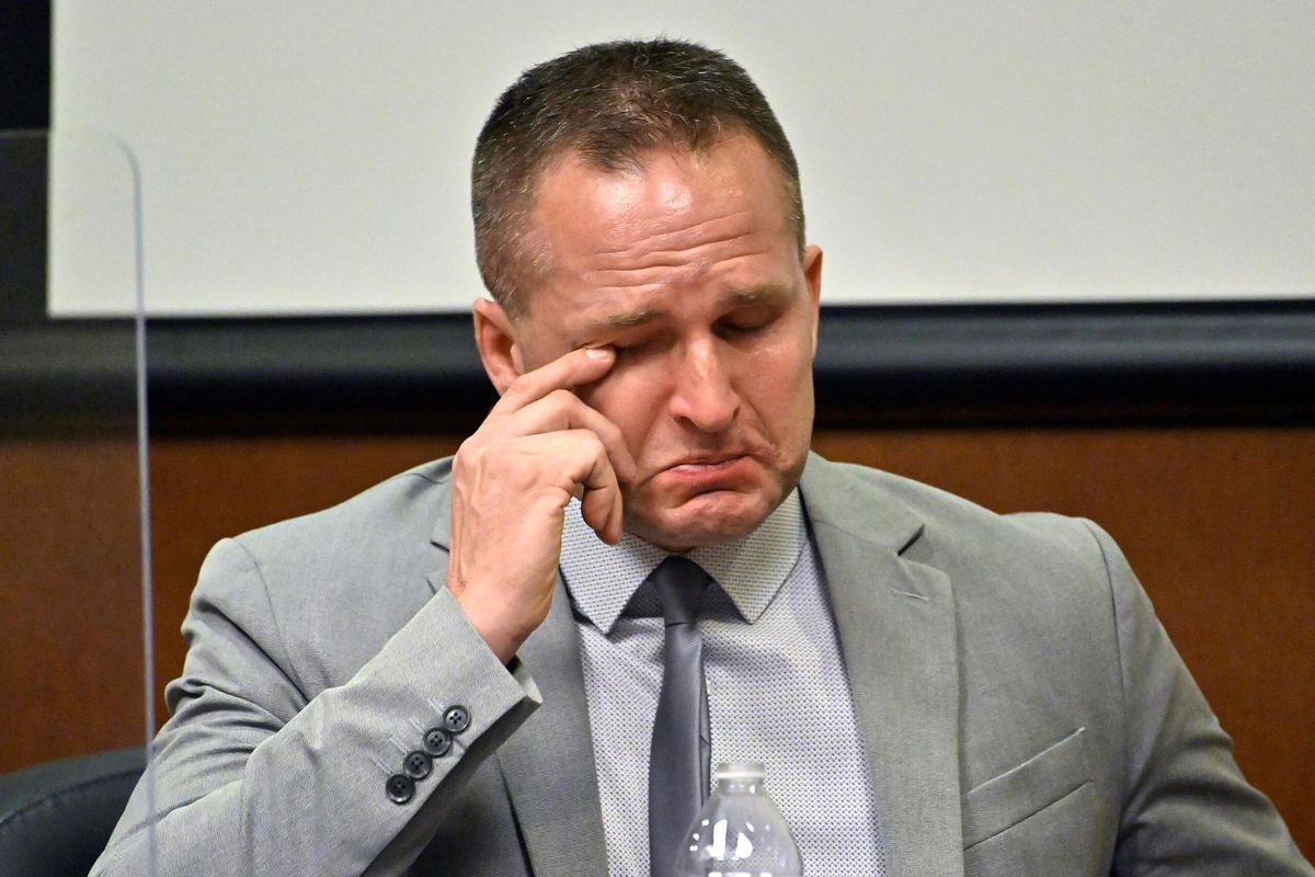 Brett Hankison wipes a tear from his eye as he is questioned by his defense attorney on March 2, 2022, in Louisville.