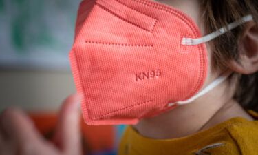 A child wears a KN95 mask.