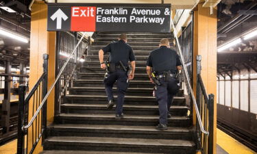 NYPD officers patrol the Franklin Avenue subway station last July in New York