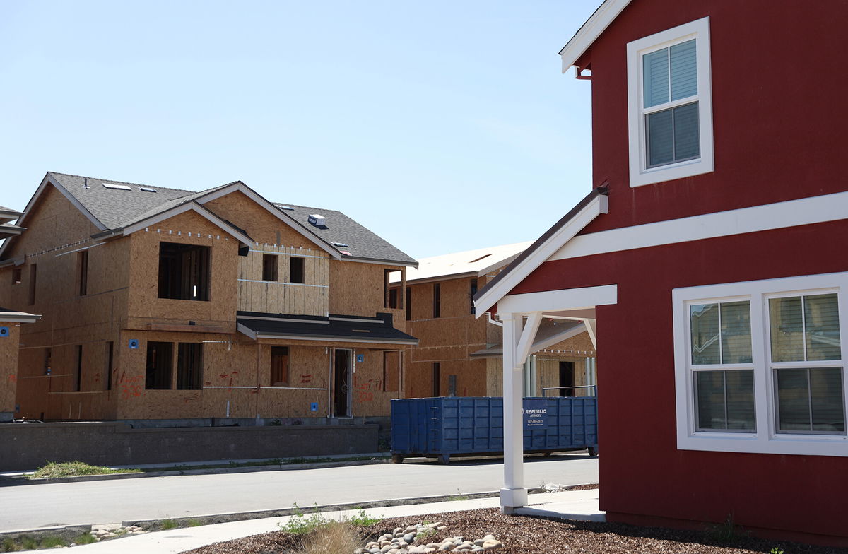 <i>Justin Sullivan/Getty Images</i><br/>A home under construction stands across from a completed home at a housing development on March 23 in Petaluma