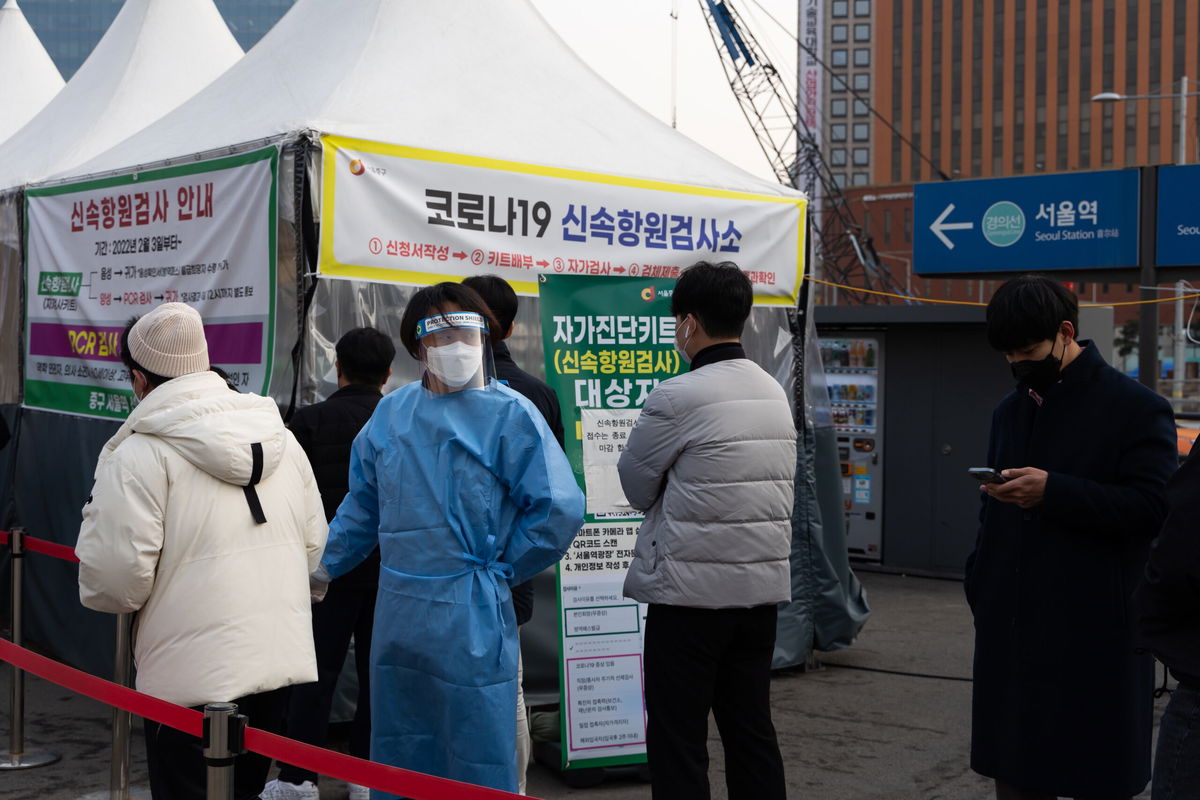 <i>SeongJoon Cho/Bloomberg/Getty Images</i><br/>Members of the public wait in line at a temporary Covid-19 testing station set up outside Seoul Station on March 4.