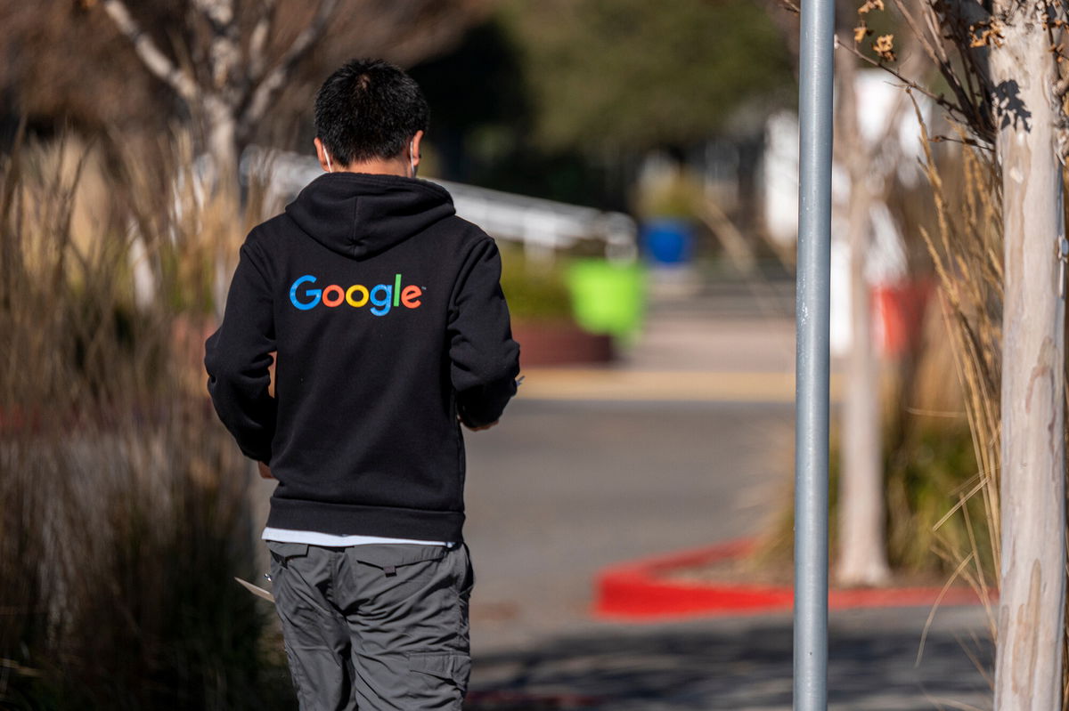 <i>David Paul Morris/Bloomberg/Getty Images</i><br/>A pedestrian wearing a Google branded hoodie walks on the Google campus at the company's headquarters in Mountain View