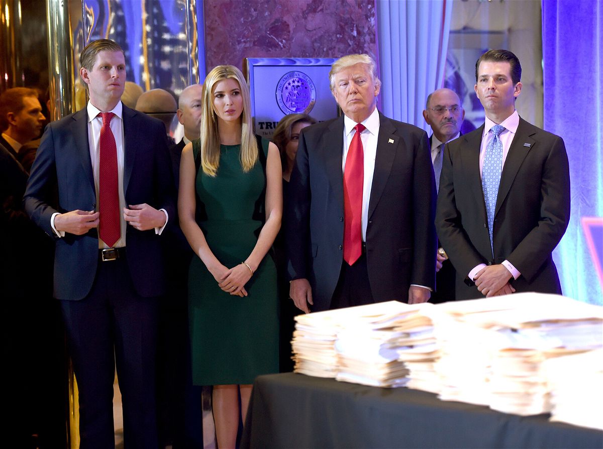 <i>TIMOTHY A. CLARY/AFP/Getty Images</i><br/>Former President Donald Trump and his children Eric (L)