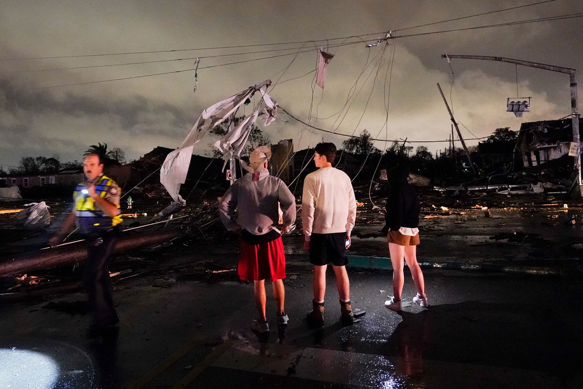 <i>Gerald Herbert/AP</i><br/>Authorities survey damage in the Lower Ninth Ward