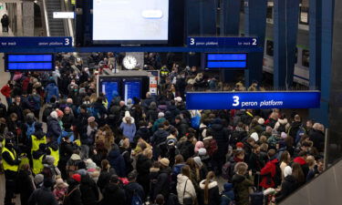 Crowds wait for a train to Berlin at Warsaw's central train station.